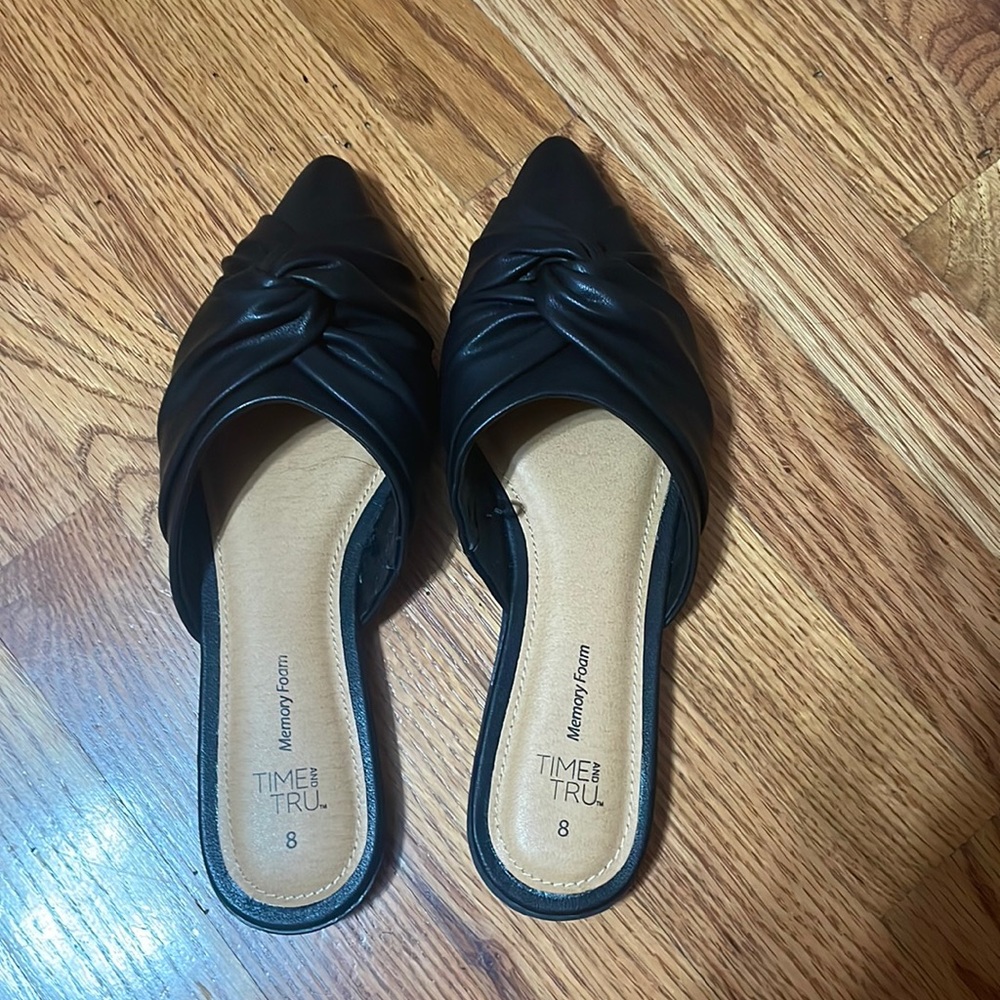 Woman’s black flat dress shoes